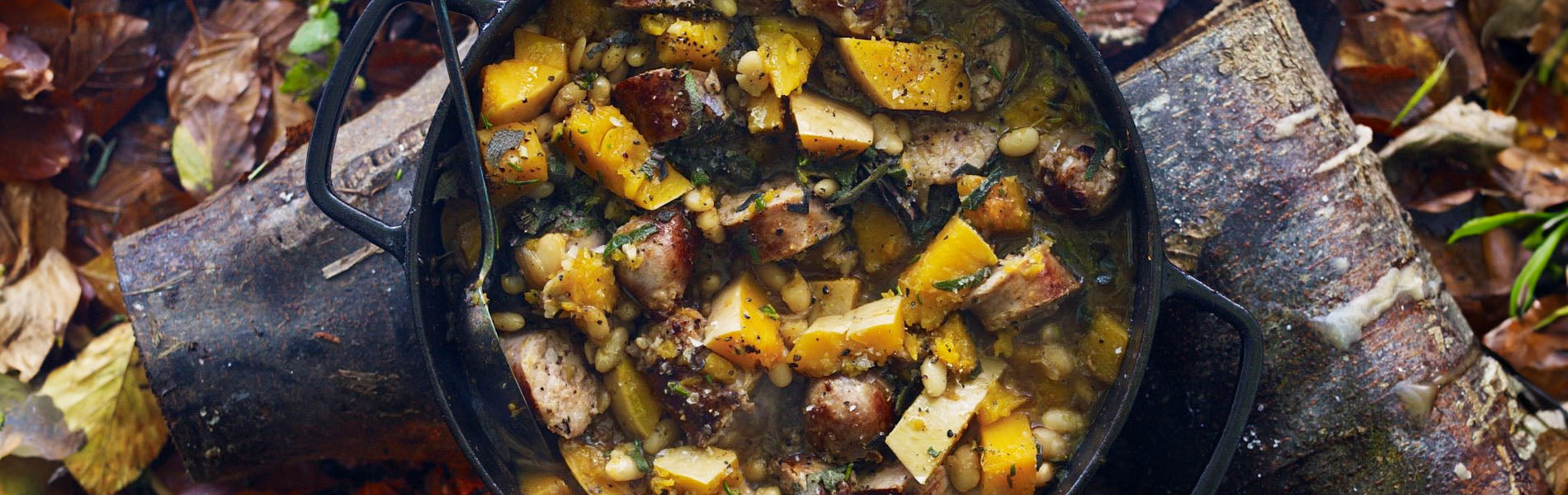 Sausages and squash with sage, rosemary and beans