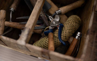 Gardening tools in a wooden box
