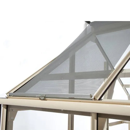 A Rhino Greenhouse window in a metal frame is propped open, allowing airflow. It is set against a clear sky, showcasing part of the structural beams inside.
